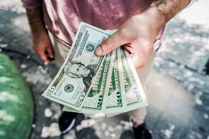Man holding $20 bills